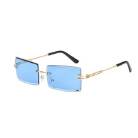 Lunettes de soleil en gros 2026 – Mode européenne et américaine, sans monture, à bords coupés, UV400, ultralégères, en métal et PC, dorées, protection solaire