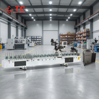 Machine polyvalente d'enveloppement de profilés à colle chaude pour produits en bois