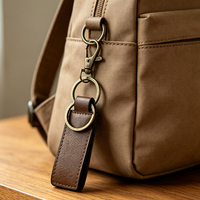 Porte-clés en cuir PU de luxe avec logo personnalisé en relief, en gros, pour cadeaux d'entreprise et souvenirs d'événements professionnels