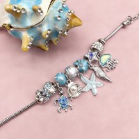Bracelet tendance en alliage avec perles, éléments de plage, étoiles de mer et cœurs – Collection été