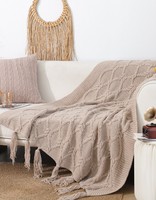 Plaid en tricot torsadé de luxe avec pompons pour la literie ou le canapé
