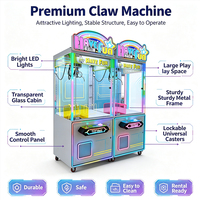 Meilleur Prix : Machine de jeu d'arcade à griffes lumineuse et colorée, machine de capture de cadeaux et de poupées tendance pour centre de jeux