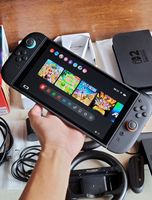 NOUVEAU Nintendo Switch 2 256 Go débloqué toutes régions avec Mario Kart et 5 jeux, console avec manettes blanches, rouges et bleues
