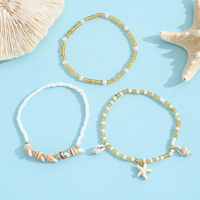 Bracelets à breloques coquillages et étoiles de mer, perles ambre, or et blanches, ensemble de bijoux thème océan et plage, cadeau pour femme