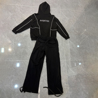 Ensemble survêtement homme noir et blanc à empiècements, avec capuche et pantalon, passepoil contrastant, streetwear, coupe oversize, grammage lourd, fabricant OEM personnalisé