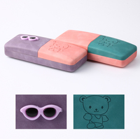 Boîtier optique Collage par ultrasons de couleurs bicolores en matériau PU Étui à lunettes rigide pour enfants avec accessoires en plastique