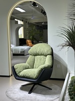 Fauteuil pivotant d'appoint en tissu texturé vert mousse, fauteuil lounge rembourré avec base en métal noir pour salon ou hôtel