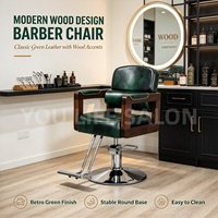 Fauteuil de barbier vintage en cuir vert avec accoudoirs en bois massif, chaise de coiffure robuste à vérin hydraulique pour salon de coiffure