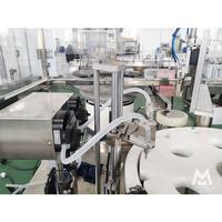Machine automatique de remplissage et de bouchage de flacons compte-gouttes pour huiles essentielles