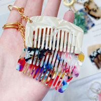 Vente en gros d'usine, modèles variés, logo personnalisé, mini peigne porte-clés portable en acétate pour cheveux