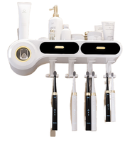 Support mural 2-en-1 en ABS+PS+Silicone pour cosmétiques et distributeur de dentifrice/brosse à dents, blanc/noir – Nouveauté 2024
