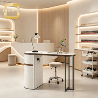 Station de travail professionnelle pour ongles avec design à bords incurvés et grand plateau pour salon d'esthétique