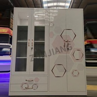 Armoire en acier verrouillable vert marguerite avec portes et tiroirs en verre, rangement de vêtements pour chambre à coucher