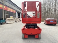 Piattaforma a forbice elettrica semovente in acciaio al manganese da 500 kg con velocità di sollevamento di 3-5 m/min per lavori di gestione delle strutture