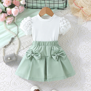 Ensemble Deux Pièces T-shirt à Manches Bulles et Jupe Courte à Nœud Couleur Unie pour Filles – Vente en Gros - Product Image 3