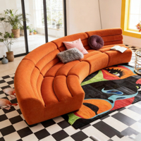 Canapé modulaire en velours orange incurvé pour salon moderne