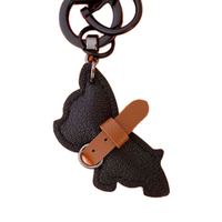Nouvel arrivage Porte-clés de luxe pour chiot Pendentif lanière anti-perte avec corde tissée Porte-clés voiture de combat pour chien en cuir de qualité supérieure