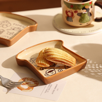 Assiette à toast en céramique personnalisée en forme de pain, assiette à collation et dessert, OEM ODM, vente en gros, pour café, boulangerie, cadeau, directement de l'usine, approvisionnement en vrac, nouveau modèle