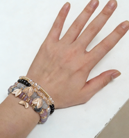 Bracelets de perles extensibles en verre style bohème à prix de gros pour femmes, avec pendentifs trèfle à quatre feuilles