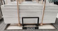 Chine Marbre en bois blanc en finition mate Carreaux incurvés en marbre en bois blanc pour carreaux de revêtement de façade de mur extérieur