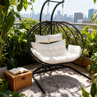 Fauteuil suspendu rond d'extérieur avec coussins en peluche, structure en métal, couleurs personnalisées disponibles pour des meubles de patio confortables