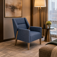 Fauteuil rembourré bleu pour l'hôtellerie, idéal pour les chambres d'hôtel, les suites, les halls d'accueil et les achats en gros