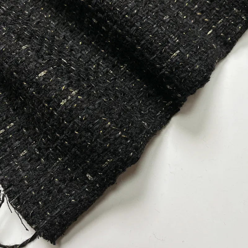 Tissu en tweed tissé noir et blanc en polyester OEM 100% Vente en gros de polyester à carreaux métalliques pour manteau de costume d'hiver