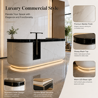 Comptoir de réception en marbre blanc avec plateau en marbre noir, éclairage LED, pour hôtel de luxe, vente en gros, directement de l'usine, logo personnalisé