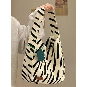 Gran oferta 2025, bolso de cuero PU tejido de moda de lujo para mujer, Mini Dumpling Jodie, bolso de hombro con tiras en blanco y negro, bolsos de mano - Product Image 1