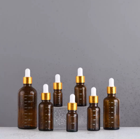 Flacon compte-gouttes en verre ambré gradué avec pipette en caoutchouc marron, flacon vide avec échelle graduée pour sérum et huiles essentielles