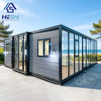 Module de vie rectangulaire HeSHi moderne et détachable, type conteneur, avec murs et porte en verre pour usage extérieur