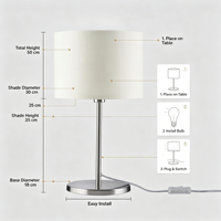 Lampe de table moderne en tissu, avec support en métal nickel brossé et abat-jour cylindrique en tissu crème, idéale pour chambre à coucher et hôtel