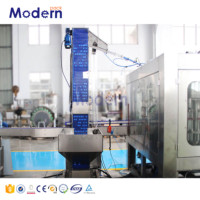 Machine de remplissage électrique d'eau minérale pour bouteilles PET Moteur PLC automatique intégrant le bouchage de remplissage de lavage pour produits chimiques