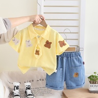 Petit garçon été nouvel ensemble dessin animé revers à la mode à manches courtes deux pièces ensemble bébé mignon ensemble en gros