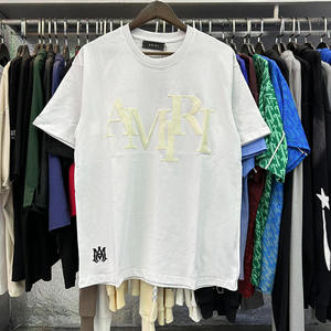 เสื้อยืดคอตตอนแท้พิมพ์ลายโฟมตัวอักษร Ami แบรนด์แฟชั่นยุโรปอเมริกา XX ทรงหลวม ระบายอากาศได้ดี สำหรับผู้ชายและผู้หญิง - Product Image 2