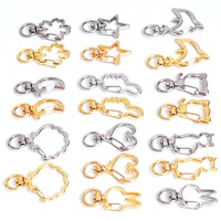 Vente Flash : Porte-clés pivotant en métal avec fermoir mousqueton, formes variées (Lune, Étoile, Fleur)