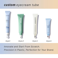 Emballage personnalisé pour crème pour les yeux en alliage métallique avec applicateur de massage en alliage de zinc, tube souple en plastique vide