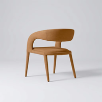 Fauteuil de salle à manger en cuir avec coussin en mousse haute densité, structure tubulaire en acier poli et design à barillet ouvert pour la salle à manger à domicile