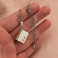 Bijoux personnalisés en acier inoxydable gravés avec logo personnalisé Collier pendentif livre pliable de simulation 3D pour couple