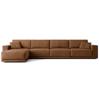 Canapé d'angle en cuir au design tendance en forme de L, avec accoudoirs larges et coussins moelleux pour salon