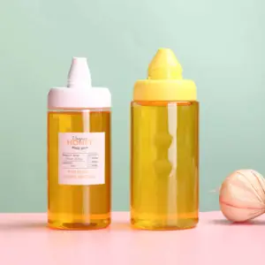180ml 300ml pot de miel transparent de qualité alimentaire bouteille de miel en plastique PET à presser avec bouchons en plastique