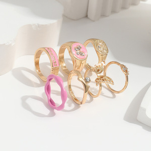 ZL-173 Kit de Joyería para Mujer, Anillos de Aleación Dorada con Cristales, Diamantes de Imitación y Esmalte en Forma de Ojo de Mariposa y Corazón, 7 Piezas - Product Image 3