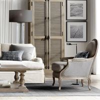 Fauteuil simple de salon style rétro américain, en tissu gris vieilli et durable, idéal pour l'hôtellerie.