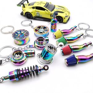 1 pièce Porte-clés de voiture en métal chromé NEO, design moyeu de roue, bouteille de gaz azote, amortisseur, sifflet, Dropshipping - Product Image 1