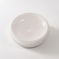 Lavabo rond en céramique moderne sous le comptoir pour lavabo à main dans la salle de bain des toilettes de l'hôpital