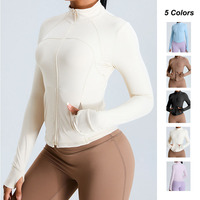 Veste de yoga en gros à fermeture éclair, manches longues, coupe ajustée, avec trou pour le pouce, col montant, pour la course et le sport