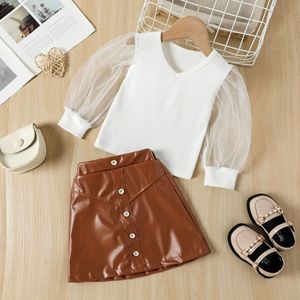Nouvelle mode, ensemble de vêtements pour filles en 2 pièces, t-shirt en tricot à manches longues en tulle uni + jupe à boutons en PU, ensemble de vêtements pour filles - Product Image 2