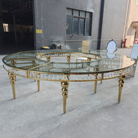 Table de mariage de luxe ronde en acier inoxydable doré avec plateau en verre miroir pour la décoration de la table de mariage