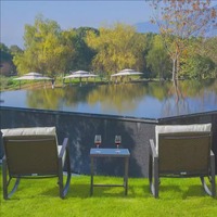 Chaise berçante pour balcon Villa Rotin tissé Ensemble de trois pièces Table et chaises de loisirs en plein air