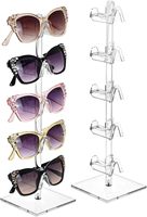 Présentoir pour lunettes de soleil Ray-Ban, montures en verre, boîtes de rangement, modèles de voiture jouet, et lunettes connectées
